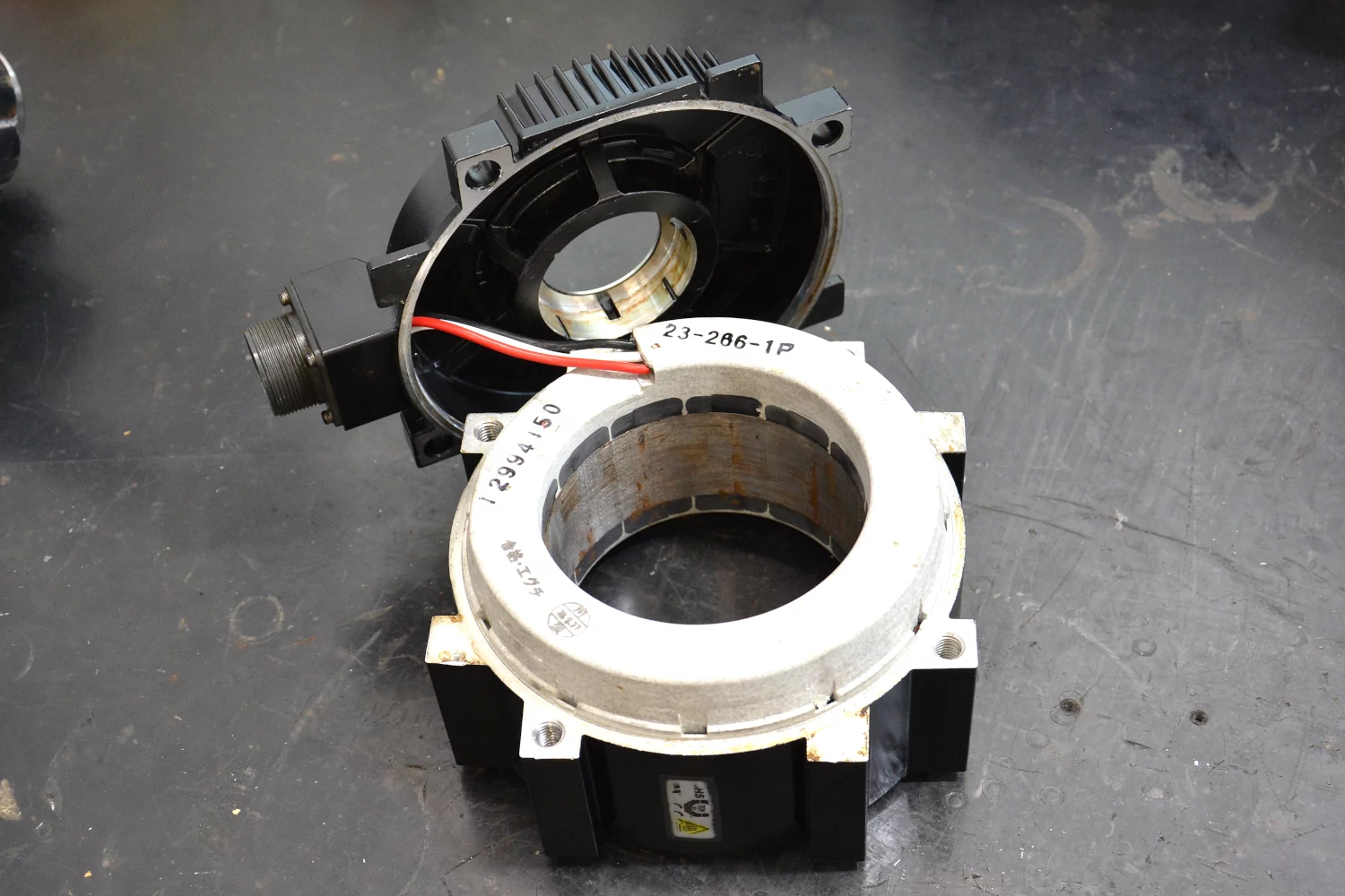 Stator with attached rear bearing cover.